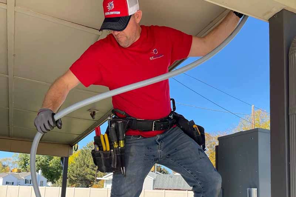 A man holding a hose.